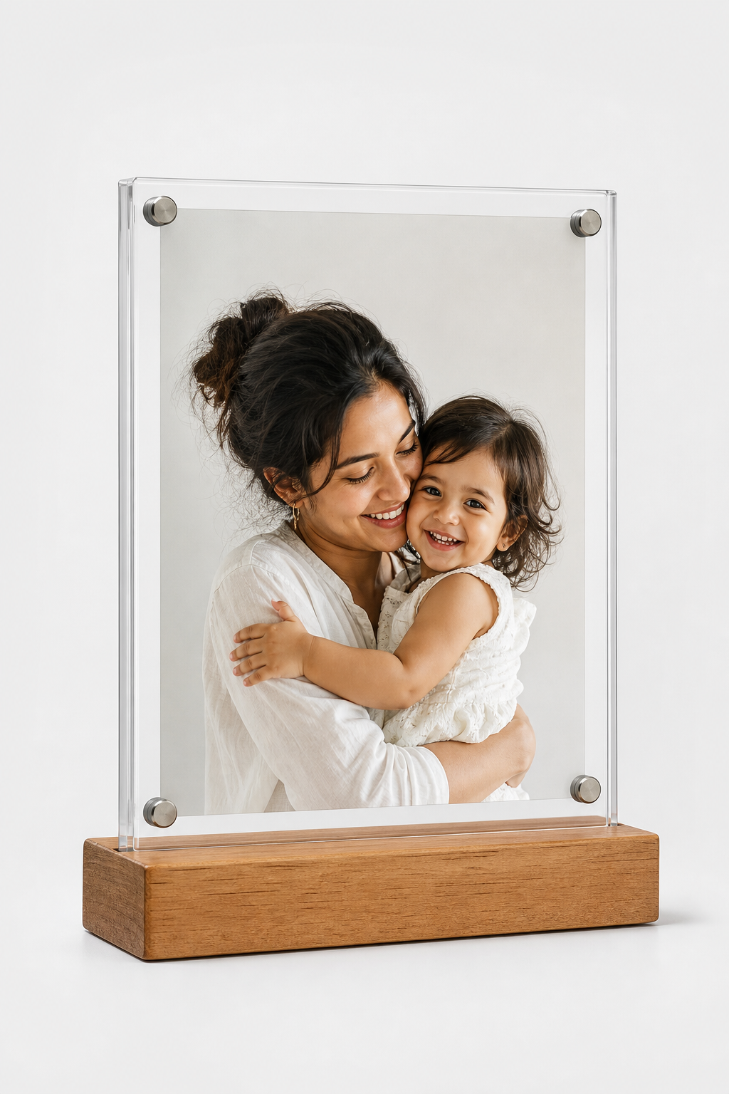 Custom acrylic photo frame with solid wooden stand displaying a vibrant family memory on a studio backdrop
