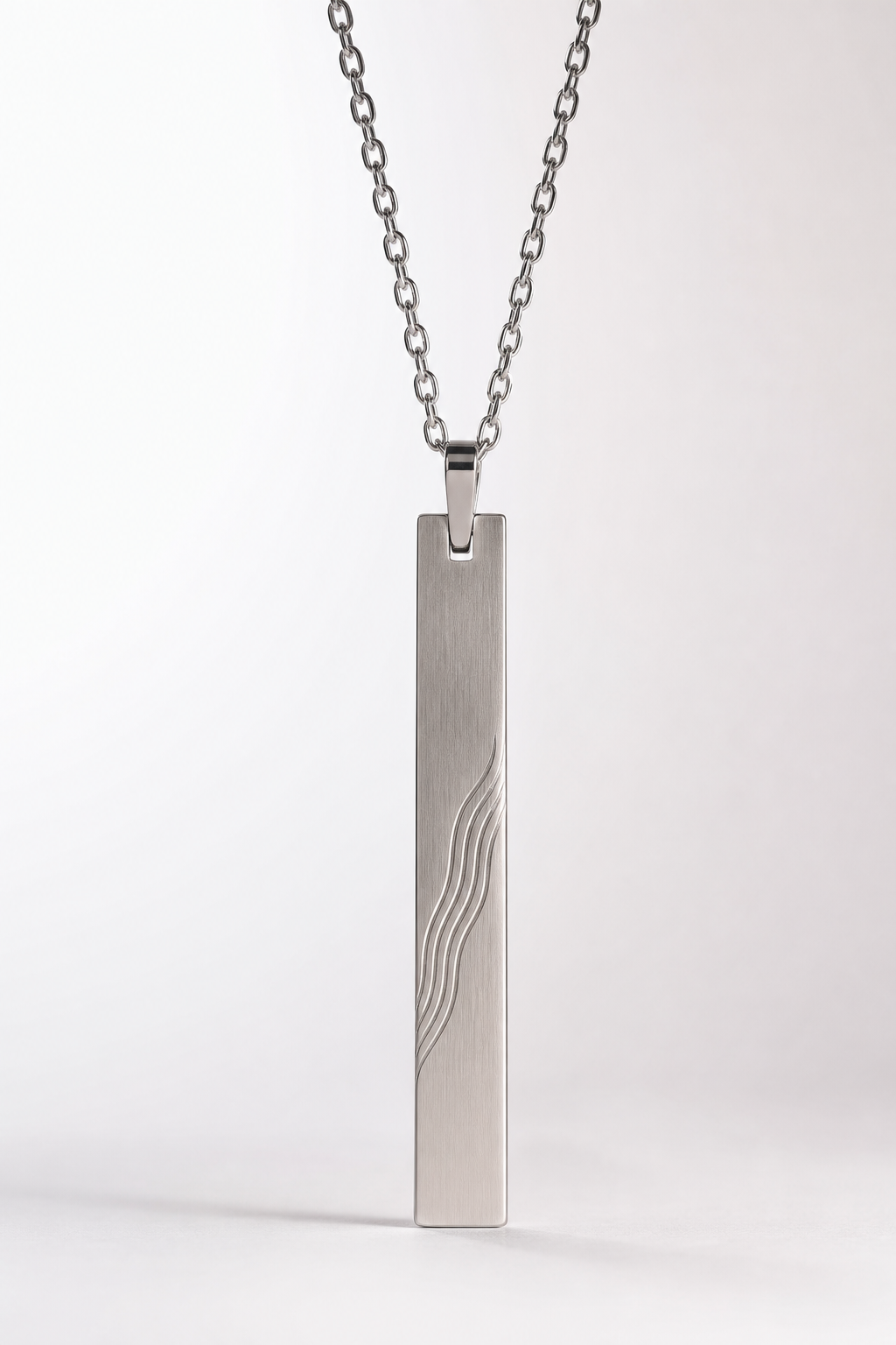 Front studio shot of custom engraved bar pendant on clean white background