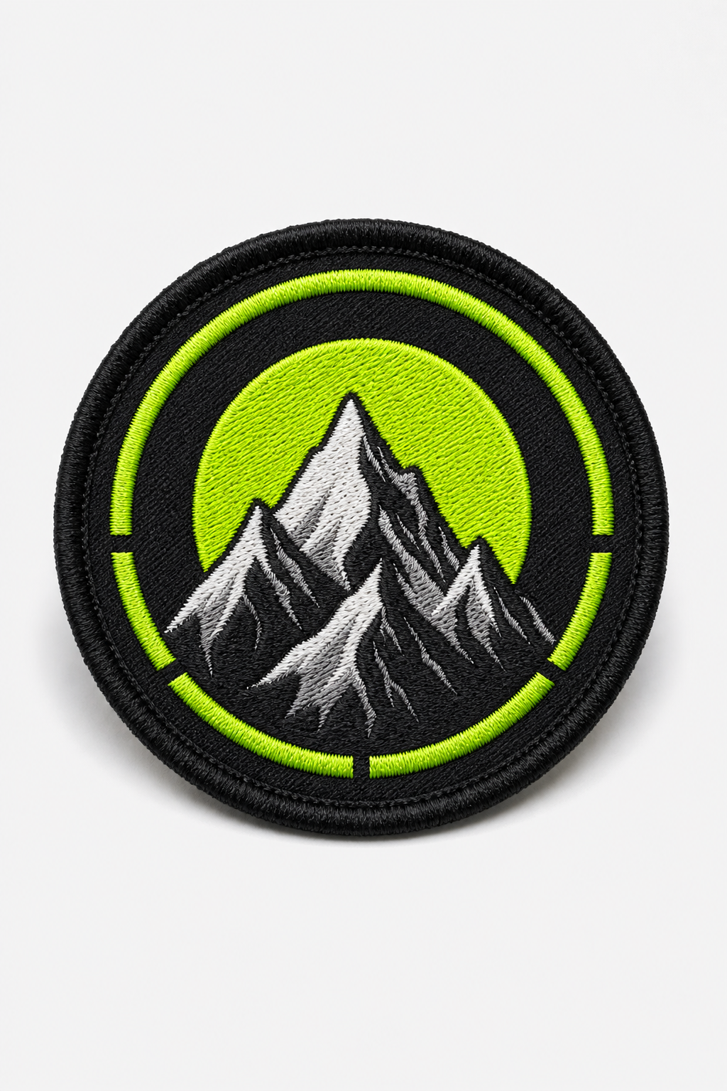 Custom embroidered patch with vibrant thread artwork against clean white studio backdrop