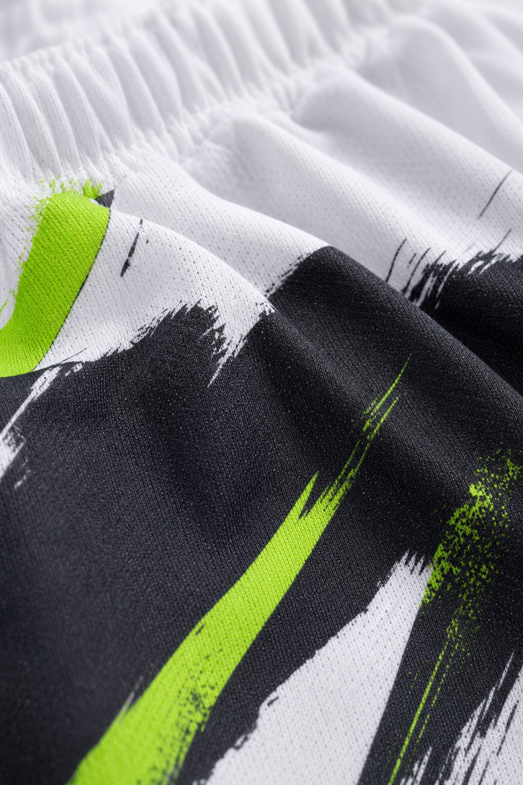 Close up detail of vibrant custom sublimation print on breathable dry fit polyester fabric